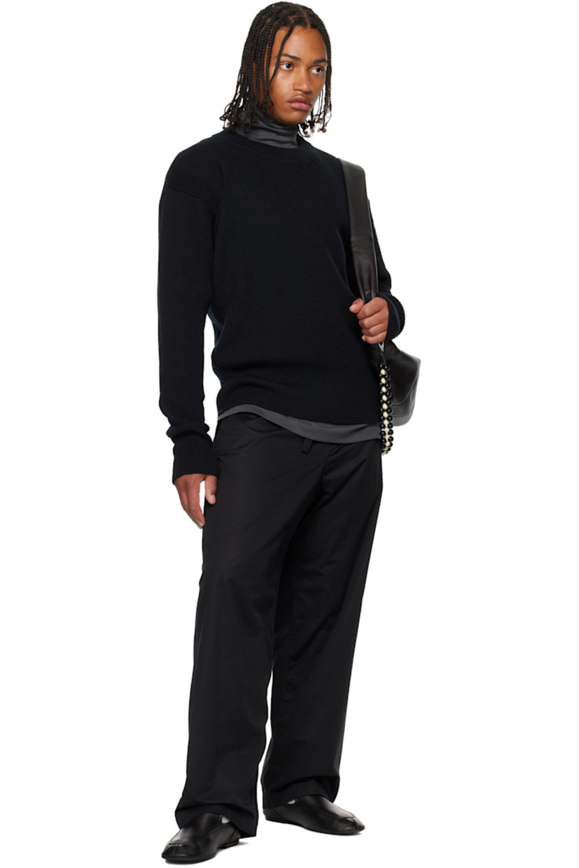 Rib-knit wool sweater. Round neck.

Supplier color: Black