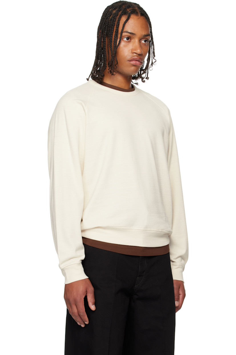 Cotton-blend French terry sweatshirt. 

· Rib-knit crewneck, hem, and cuffs
· Raglan sleeves

Supplier color: Light cream