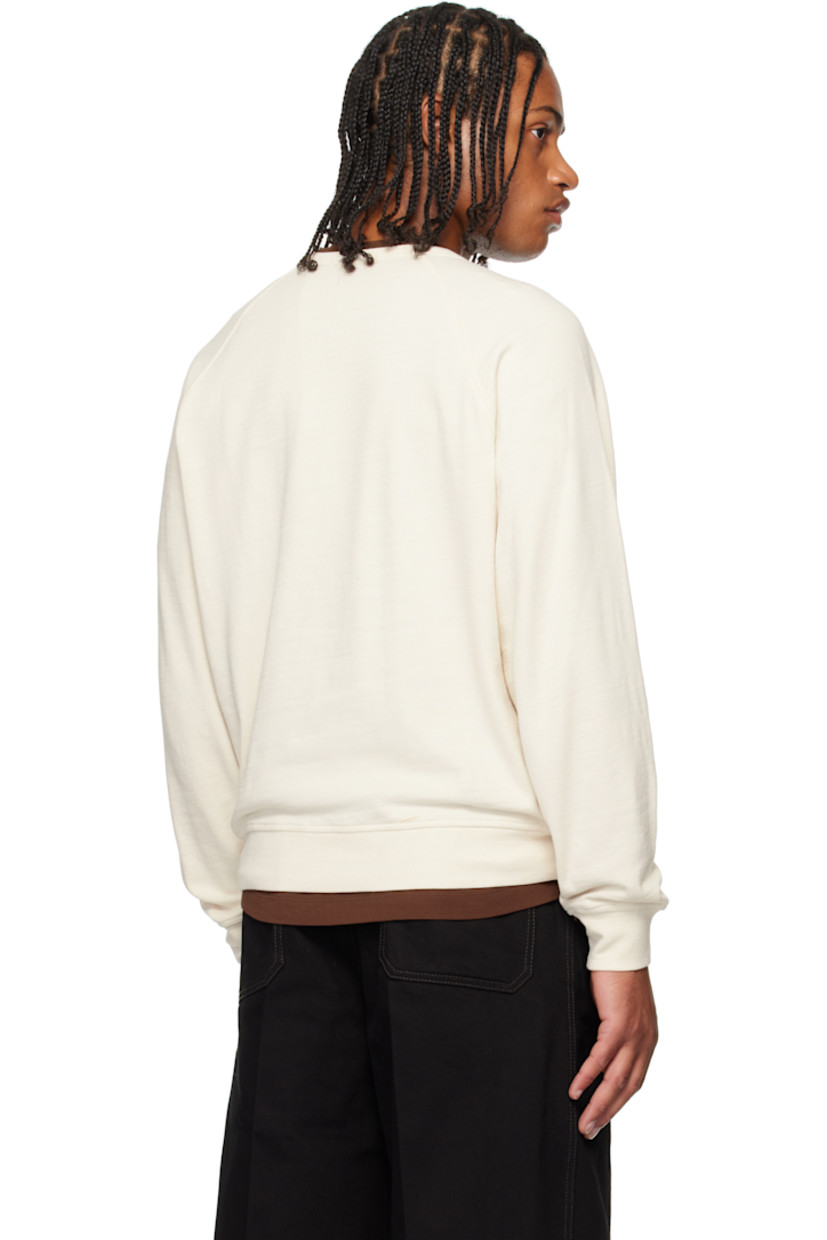 Cotton-blend French terry sweatshirt. 

· Rib-knit crewneck, hem, and cuffs
· Raglan sleeves

Supplier color: Light cream