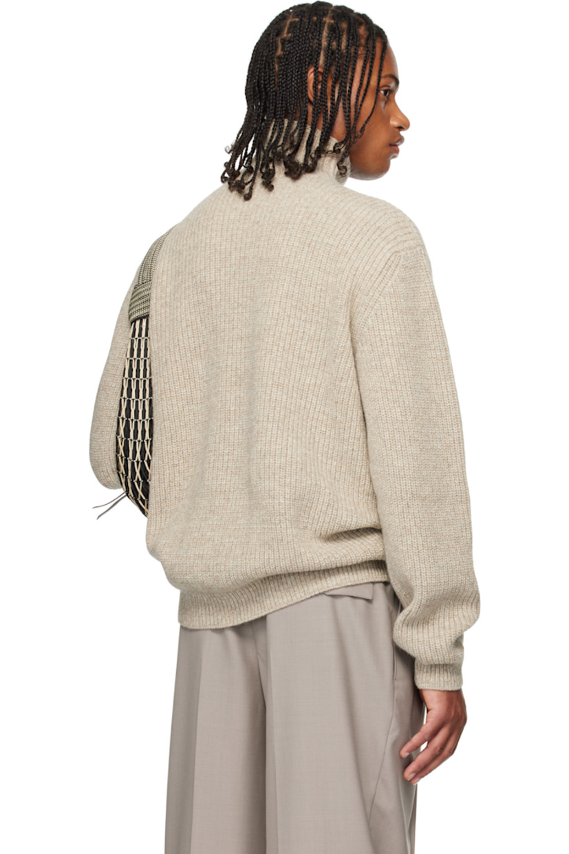 Rib-knit alpaca-blend sweater. 

· Turtleneck
· Dropped shoulders

Supplier color: Beige/Oat
