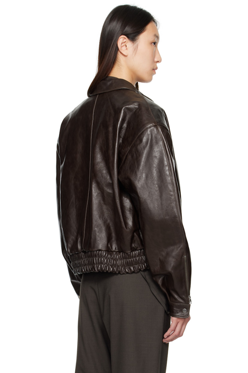 Crinkled lambskin jacket.

· Spread collar
· Zip closure
· Zip pocket at chest
· Welt pockets
· Cropped elasticized hem
· Padded shoulders
· Zip vent at press-stud cuffs
· Full satin lining

Supplier color: Brown