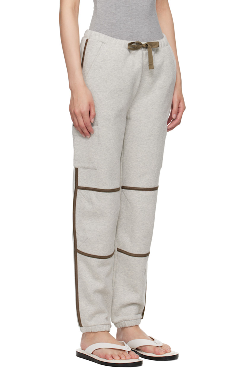 Organic cotton fleece lounge pants. Faux-leather piping throughout.

· Wide-leg
· Drawstring at elasticized waistband
· Two-pocket styling
· Elasticized cuffs
· Patch pocket at outseams

Supplier color: Grey