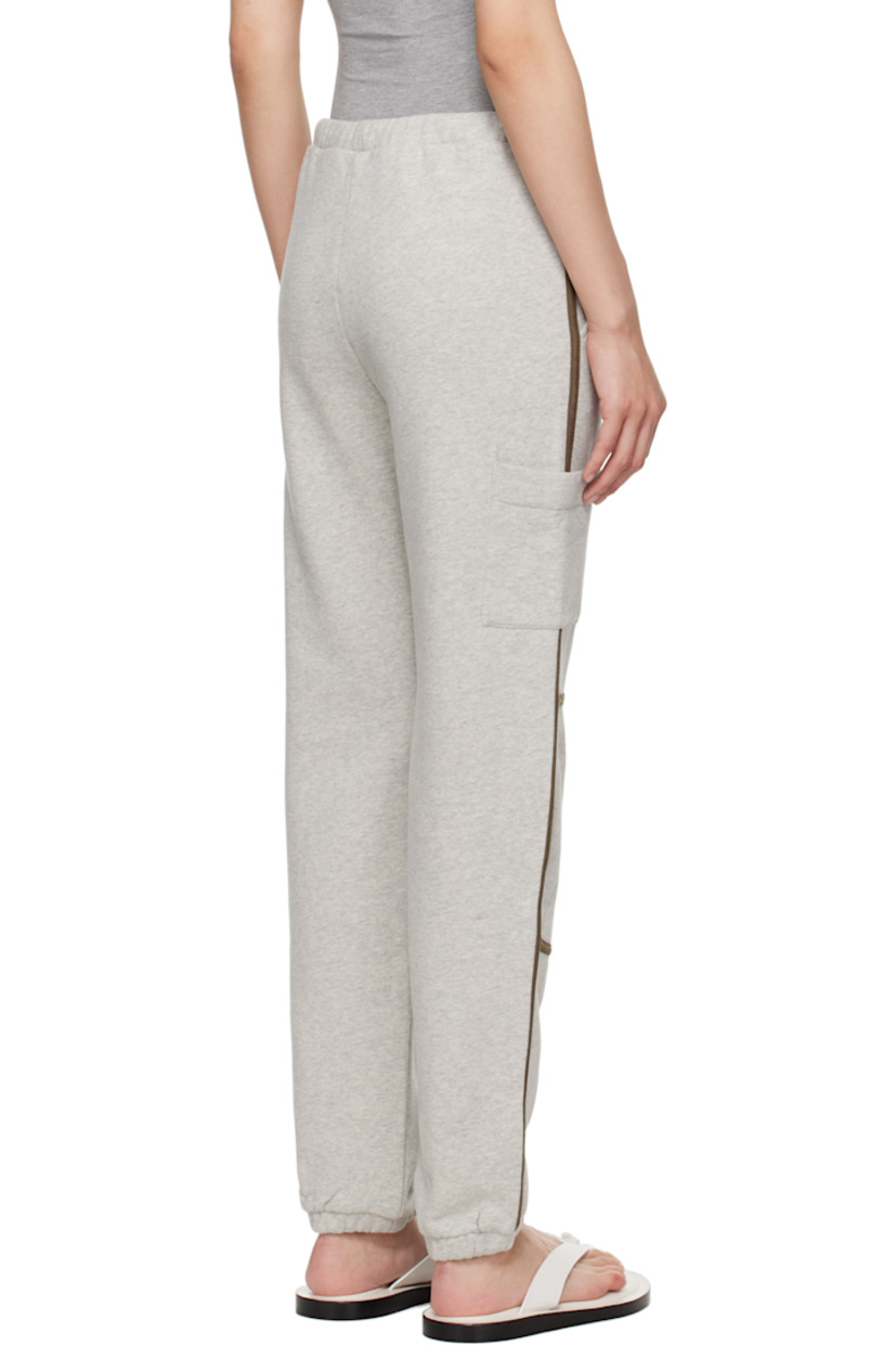Organic cotton fleece lounge pants. Faux-leather piping throughout.

· Wide-leg
· Drawstring at elasticized waistband
· Two-pocket styling
· Elasticized cuffs
· Patch pocket at outseams

Supplier color: Grey