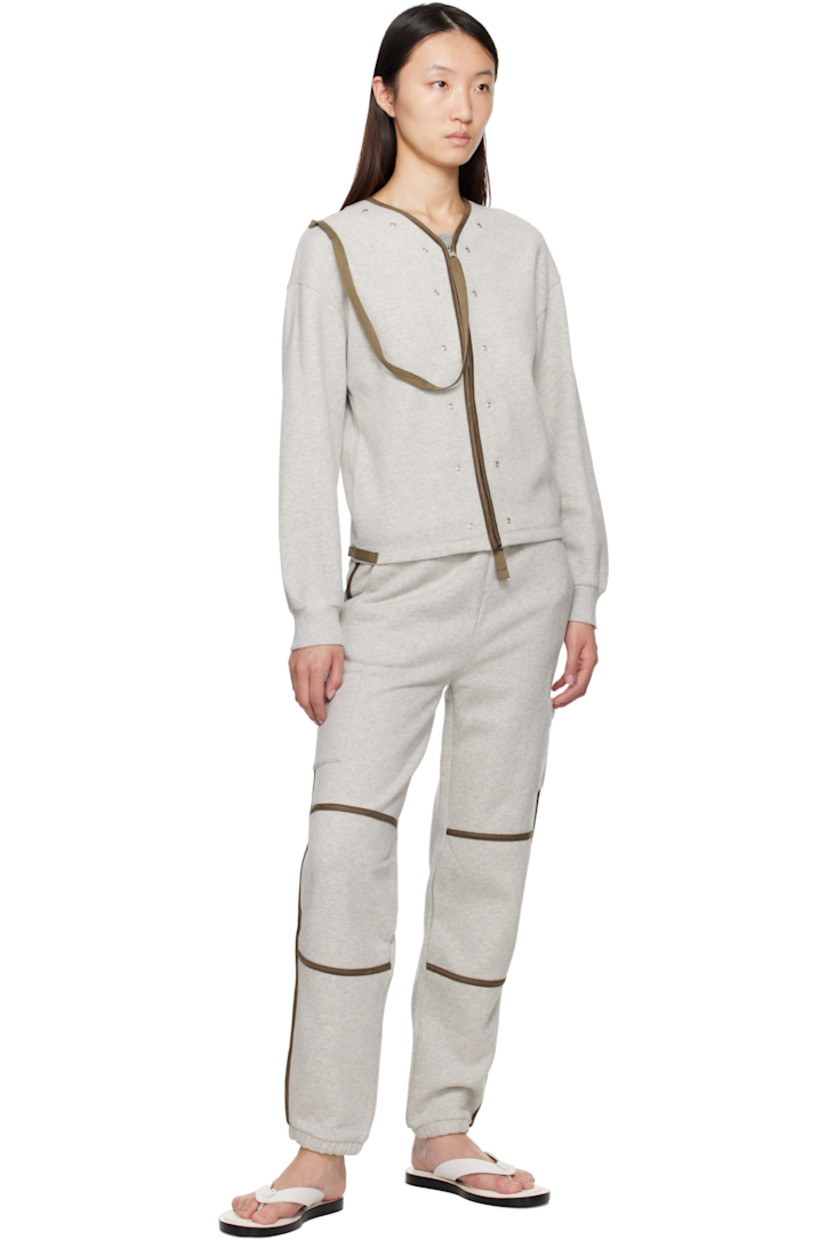 Organic cotton fleece lounge pants. Faux-leather piping throughout.

· Wide-leg
· Drawstring at elasticized waistband
· Two-pocket styling
· Elasticized cuffs
· Patch pocket at outseams

Supplier color: Grey