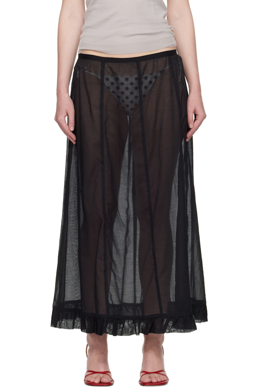 Semi-sheer organic cotton voile maxi skirt.

· Low-rise
· Ruffled trim at hem
· Zip closure at side seam

Supplier color: Black