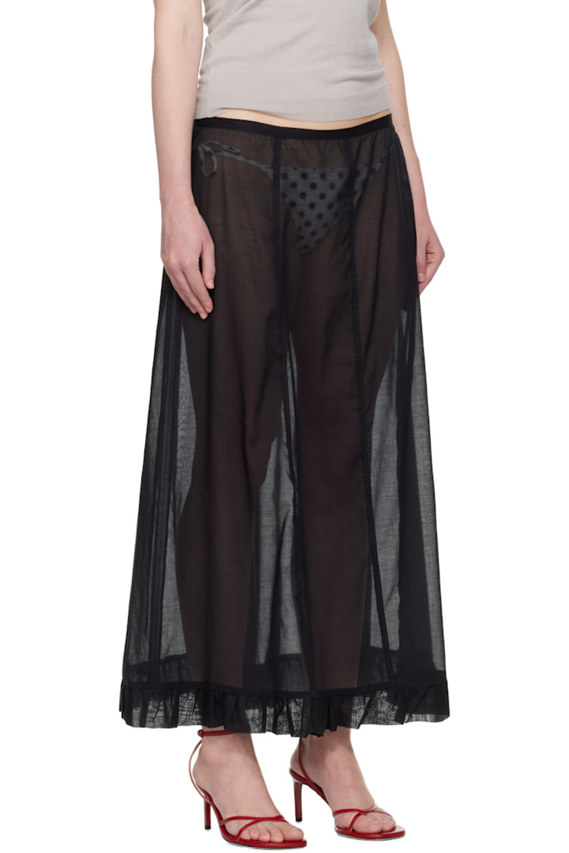 Semi-sheer organic cotton voile maxi skirt.

· Low-rise
· Ruffled trim at hem
· Zip closure at side seam

Supplier color: Black