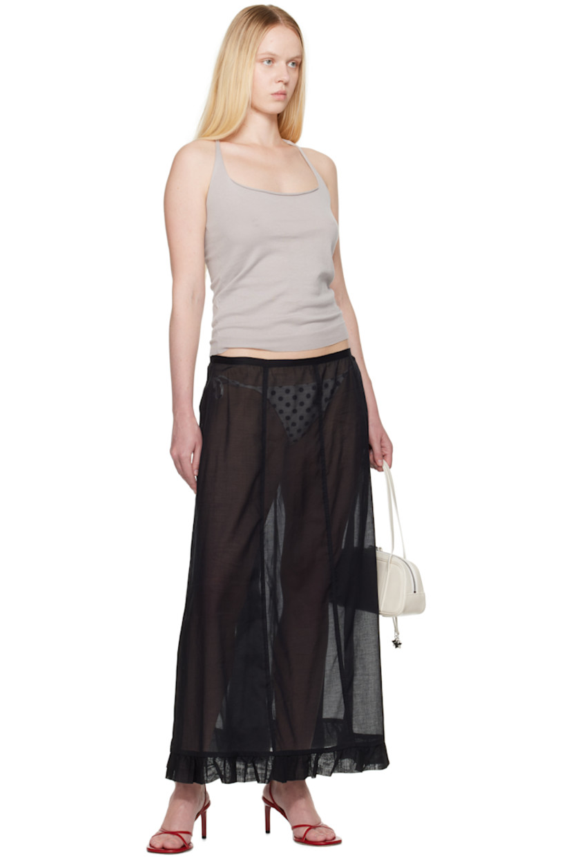 Semi-sheer organic cotton voile maxi skirt.

· Low-rise
· Ruffled trim at hem
· Zip closure at side seam

Supplier color: Black