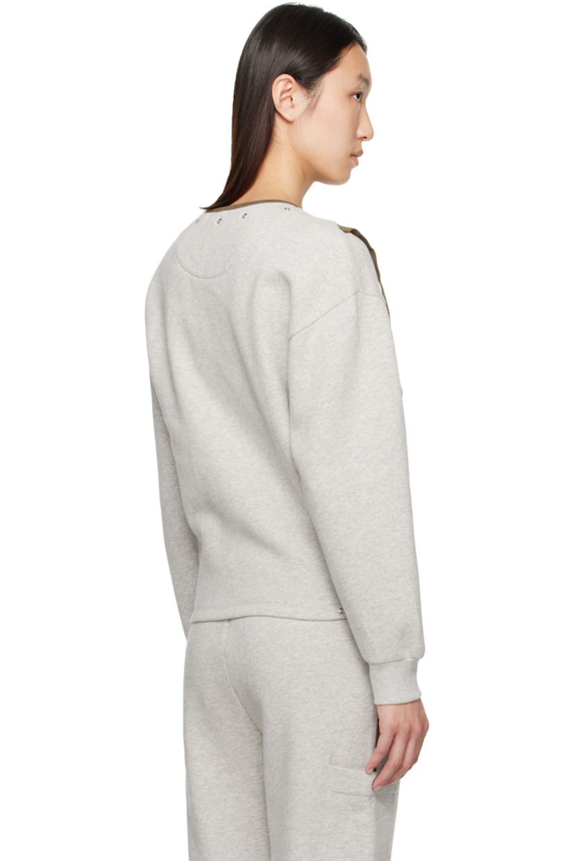 Oversized organic cotton fleece jacket.

· V-neck
· Rivets and faux-leather piping at neck and front
· Semi-detachable strap at zip closure
· Press-stud seam pockets
· Adjustable press-stud tabs at hem
· Dropped shoulders
· Rib-knit cuffs

Supplier color: Grey