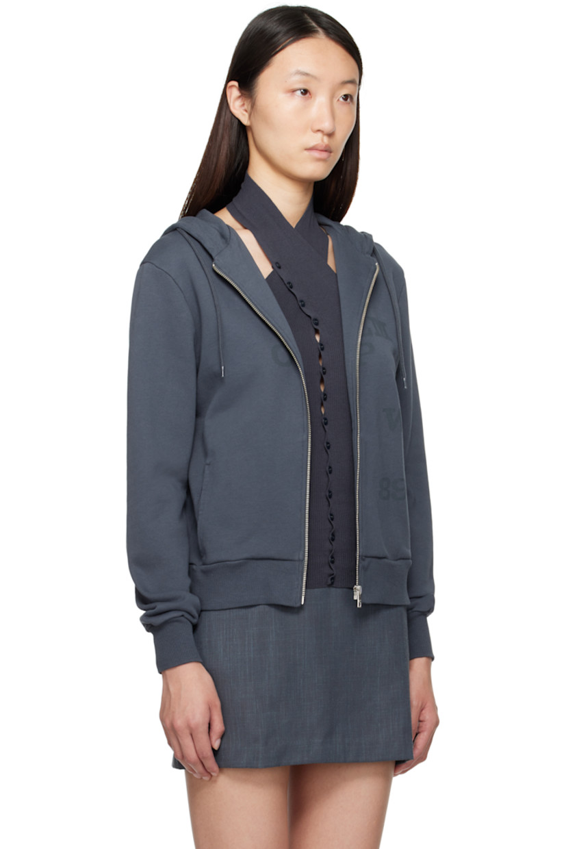 Organic cotton French terry hoodie.

· Drawstring at hood
· Zip closure
· Logo and text printed at front
· Welt pockets
· Rib-knit hem and cuffs

Supplier color: Navy