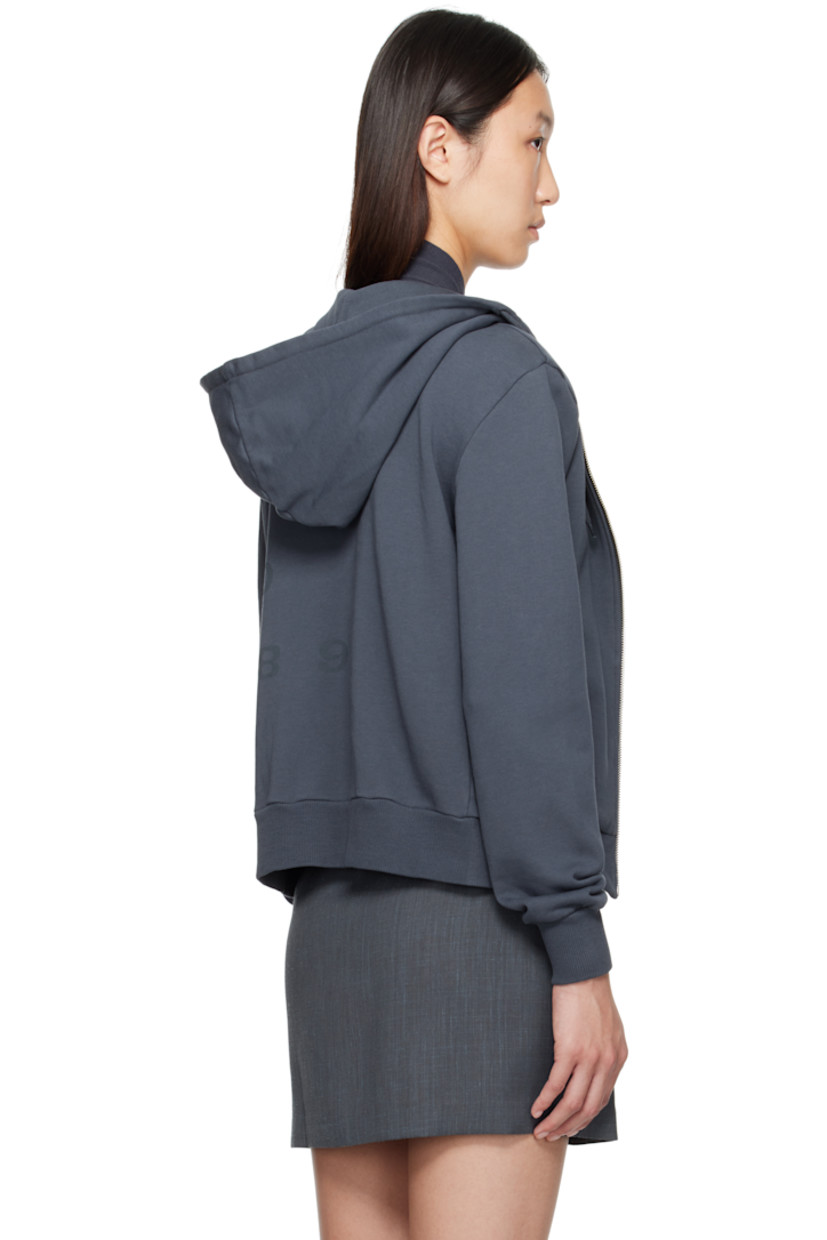 Organic cotton French terry hoodie.

· Drawstring at hood
· Zip closure
· Logo and text printed at front
· Welt pockets
· Rib-knit hem and cuffs

Supplier color: Navy