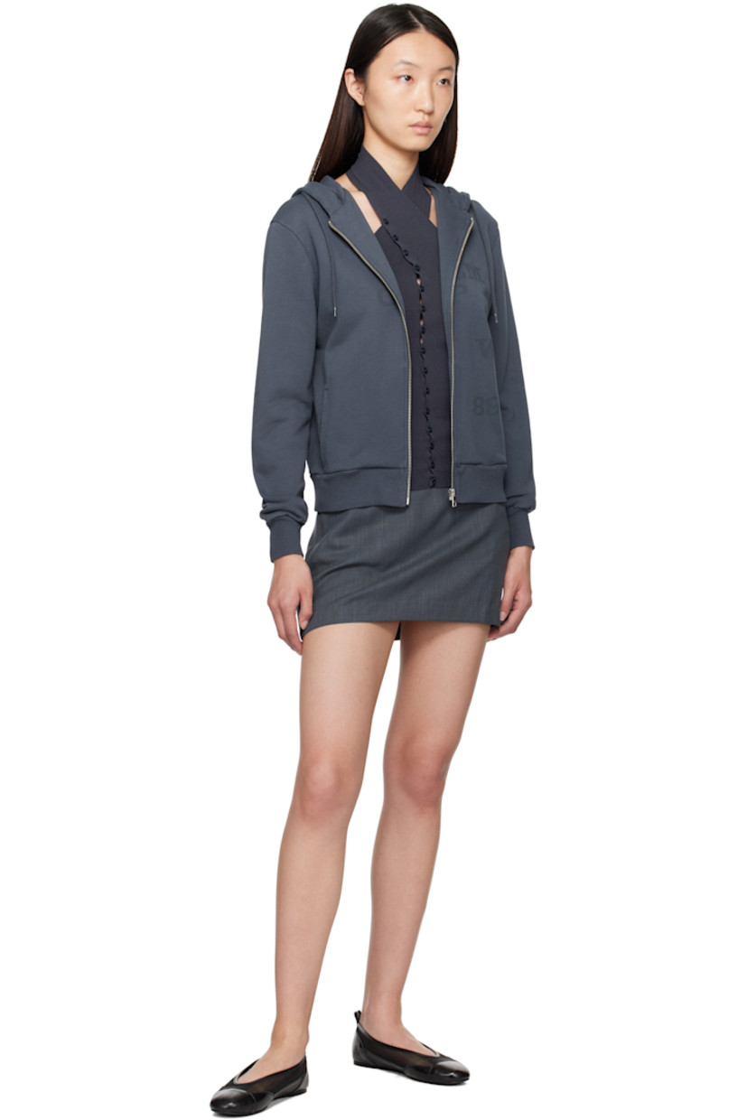 Organic cotton French terry hoodie.

· Drawstring at hood
· Zip closure
· Logo and text printed at front
· Welt pockets
· Rib-knit hem and cuffs

Supplier color: Navy