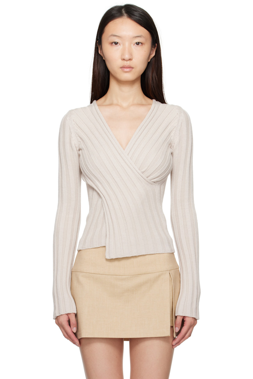 Rib-knit extrafine merino wool sweater.

· Can be worn front to back
· Wrap construction
· V-neck
�· Mulesing-free wool

Supplier color: Off-white