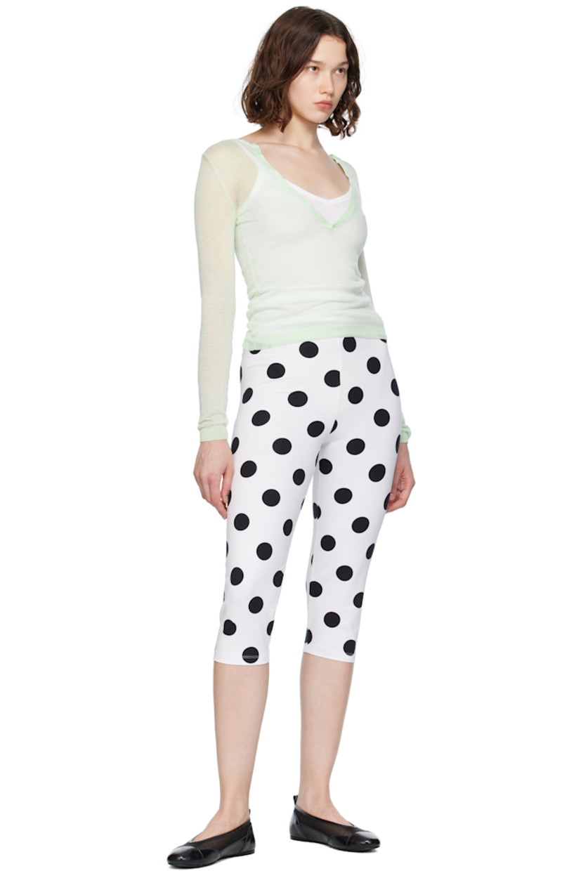 Sheer knit TENCEL™ lyocell sweater.

· Rib-knit plunging V-neck, hem, and cuffs
· Open placket

Supplier color: Green