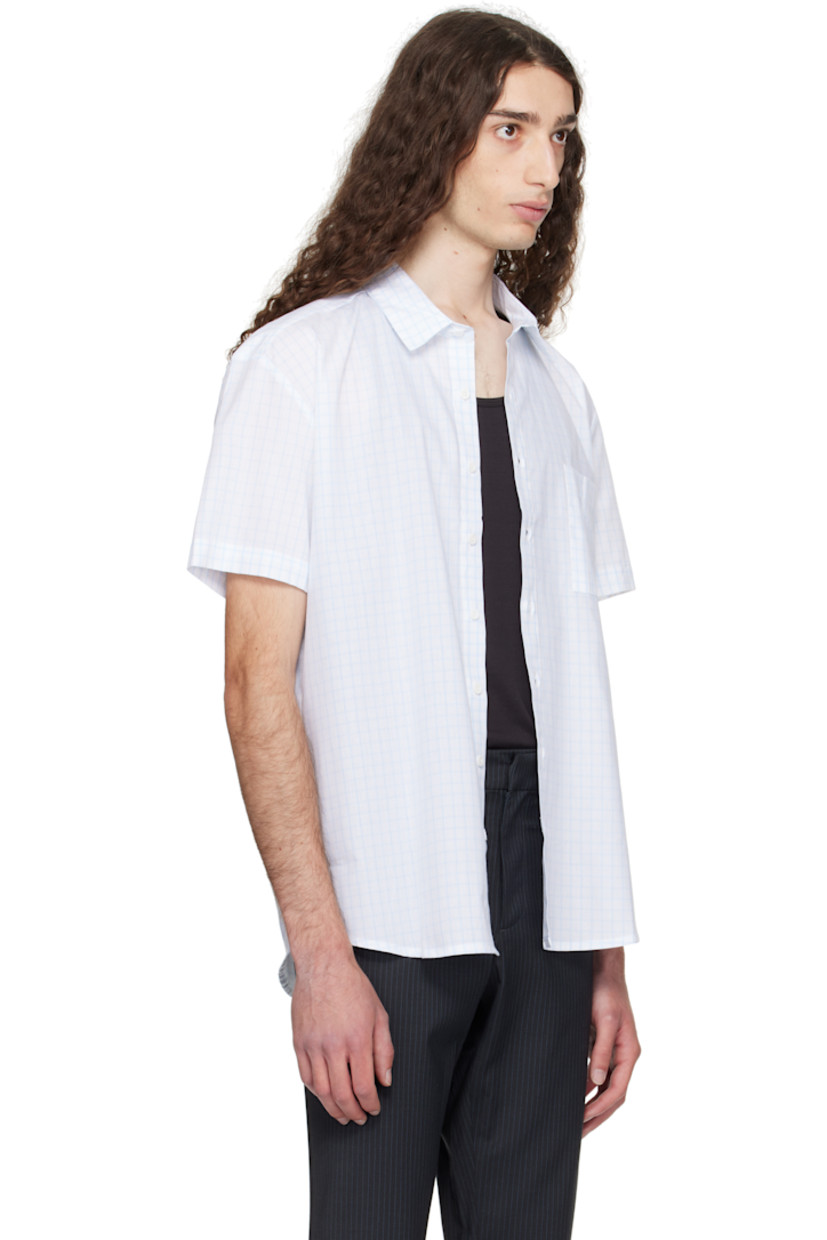 Cotton poplin shirt. 

· Check pattern printed throughout 
· Spread collar
· Button closure
· Shirttail hem 

Supplier color: Light blue