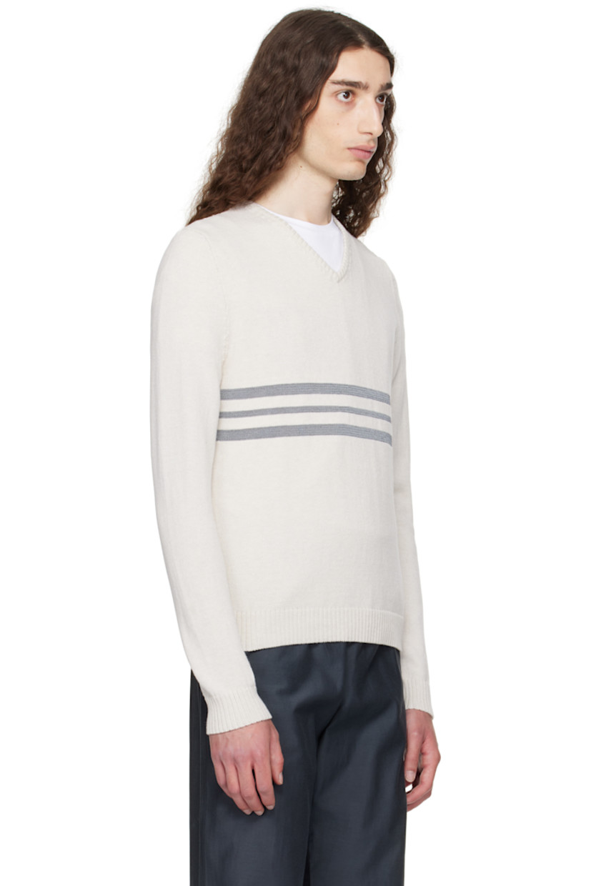 Knit organic cotton sweater. 

· Rib-knit V-neck, hem, and cuffs
· Intarsia reflective stripes at front 

Supplier color: Off-white