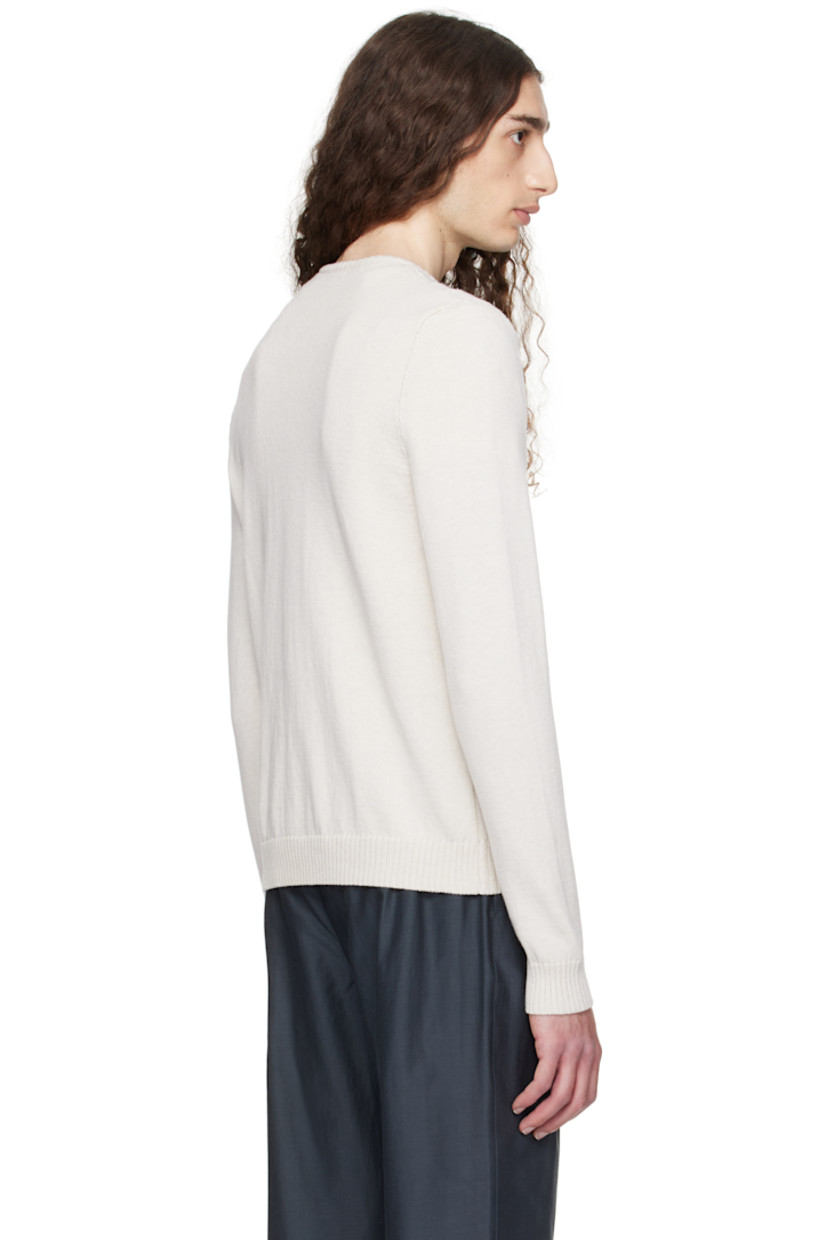 Knit organic cotton sweater. 

· Rib-knit V-neck, hem, and cuffs
· Intarsia reflective stripes at front 

Supplier color: Off-white