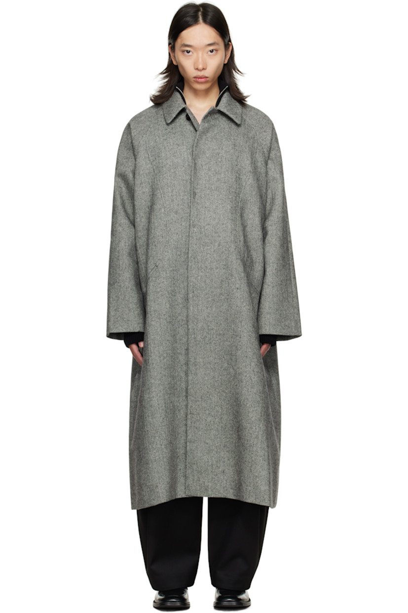 Wool tweed coat.

· Herringbone pattern throughout
· Button throat guard at spread collar
· Concealed button closure
· Welt pockets at front
· Raglan sleeves
· Patch pocket at interior
· Full satin lining

Supplier color: Black/White herringbone
