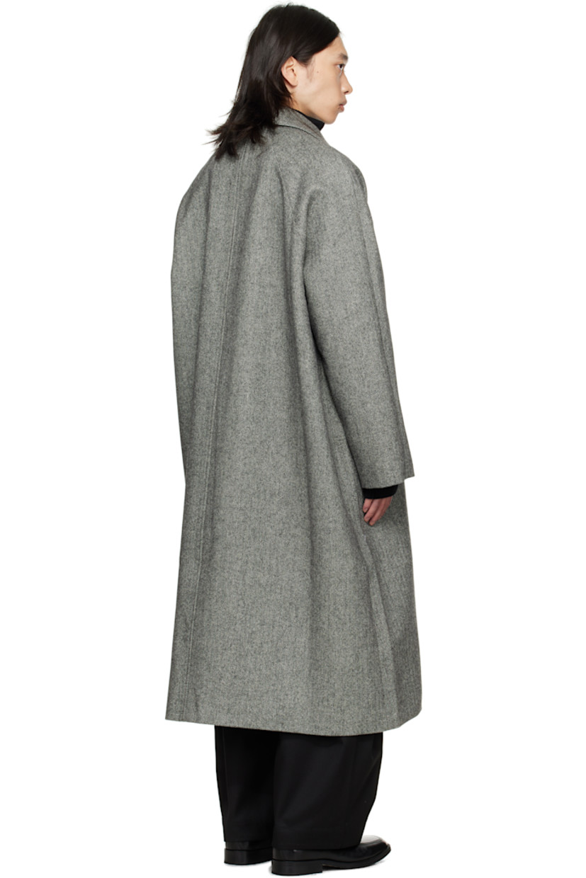Wool tweed coat.

· Herringbone pattern throughout
· Button throat guard at spread collar
· Concealed button closure
· Welt pockets at front
· Raglan sleeves
· Patch pocket at interior
· Full satin lining

Supplier color: Black/White herringbone