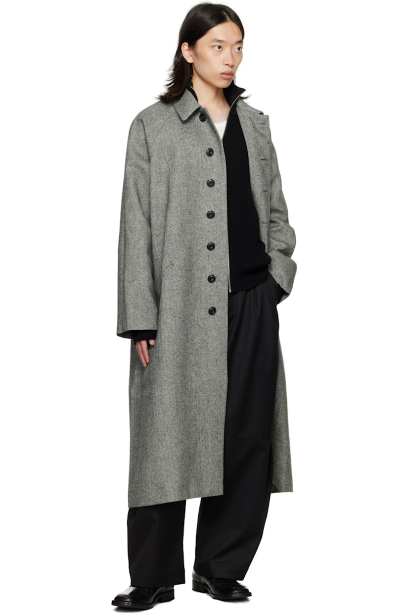 Wool tweed coat.

· Herringbone pattern throughout
· Button throat guard at spread collar
· Concealed button closure
· Welt pockets at front
· Raglan sleeves
· Patch pocket at interior
· Full satin lining

Supplier color: Black/White herringbone