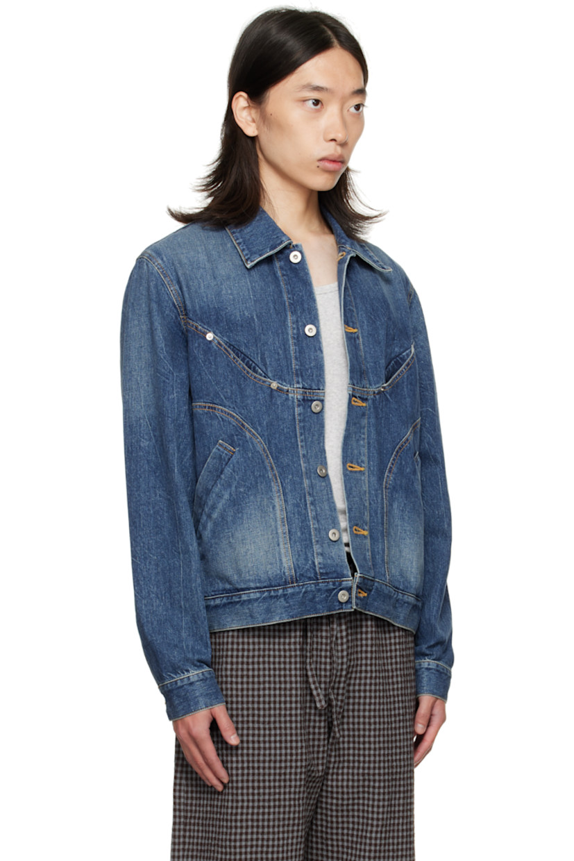 Non-stretch denim jacket.

· Fading throughout
· Spread collar
· Button closure
· Welt pockets at front
· Cropped hem
· Buttoned barrel cuffs
· Adjustable button tabs and logo patch at back hem
· Contrast stitching in tan

Supplier color: Indigo wash