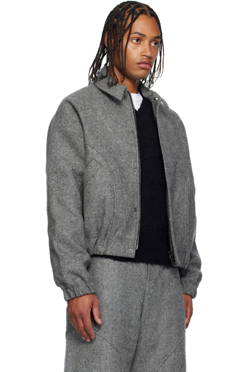 Brushed wool melton jacket. 

· Spread collar 
· Concealed two-way zip closure
· Press-stud placket 
· Welt pockets at waist
· Elasticized hem and cuffs
· Raglan sleeves
· Full twill lining

Supplier color: Marl grey