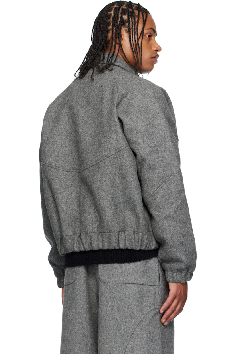 Brushed wool melton jacket. 

· Spread collar 
· Concealed two-way zip closure
· Press-stud placket 
· Welt pockets at waist
· Elasticized hem and cuffs
· Raglan sleeves
· Full twill lining

Supplier color: Marl grey