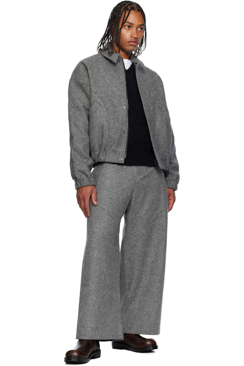 Brushed wool melton jacket. 

· Spread collar 
· Concealed two-way zip closure
· Press-stud placket 
· Welt pockets at waist
· Elasticized hem and cuffs
· Raglan sleeves
· Full twill lining

Supplier color: Marl grey