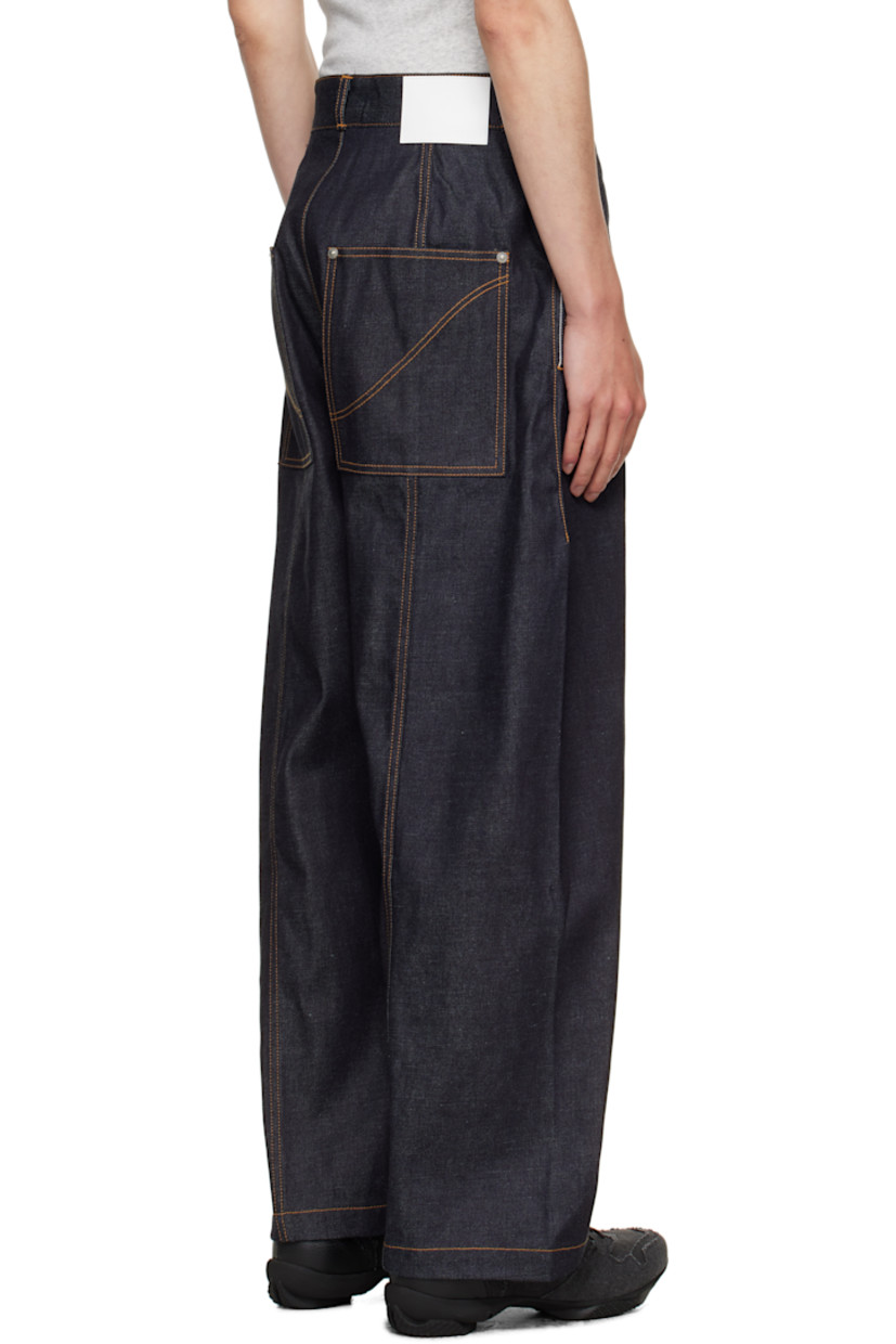 Non-stretch denim jeans.

· Belt loops
· Four-pocket styling
· Zip fly
· Central seam at legs
· Logo patch at back waistband
· Contrast stitching in tan

Supplier color: Raw denim