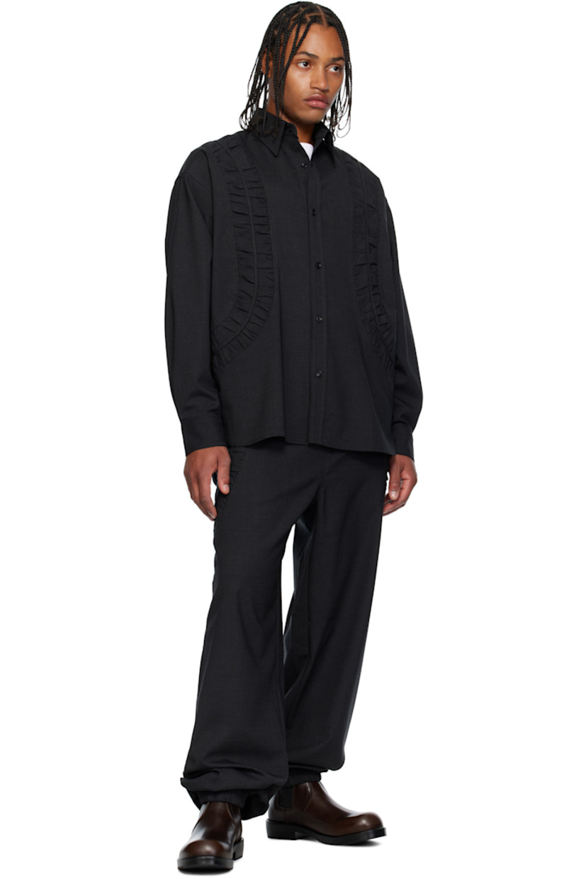 Plain-woven stretch wool-blend shirt.

· Gathering throughout 
· Spread collar 
· Button closure
· Shirttail hem 
· Pleats at buttoned barrel cuffs
· Dropped shoulders
· Box pleat at back yoke 

Supplier color: Charcoal