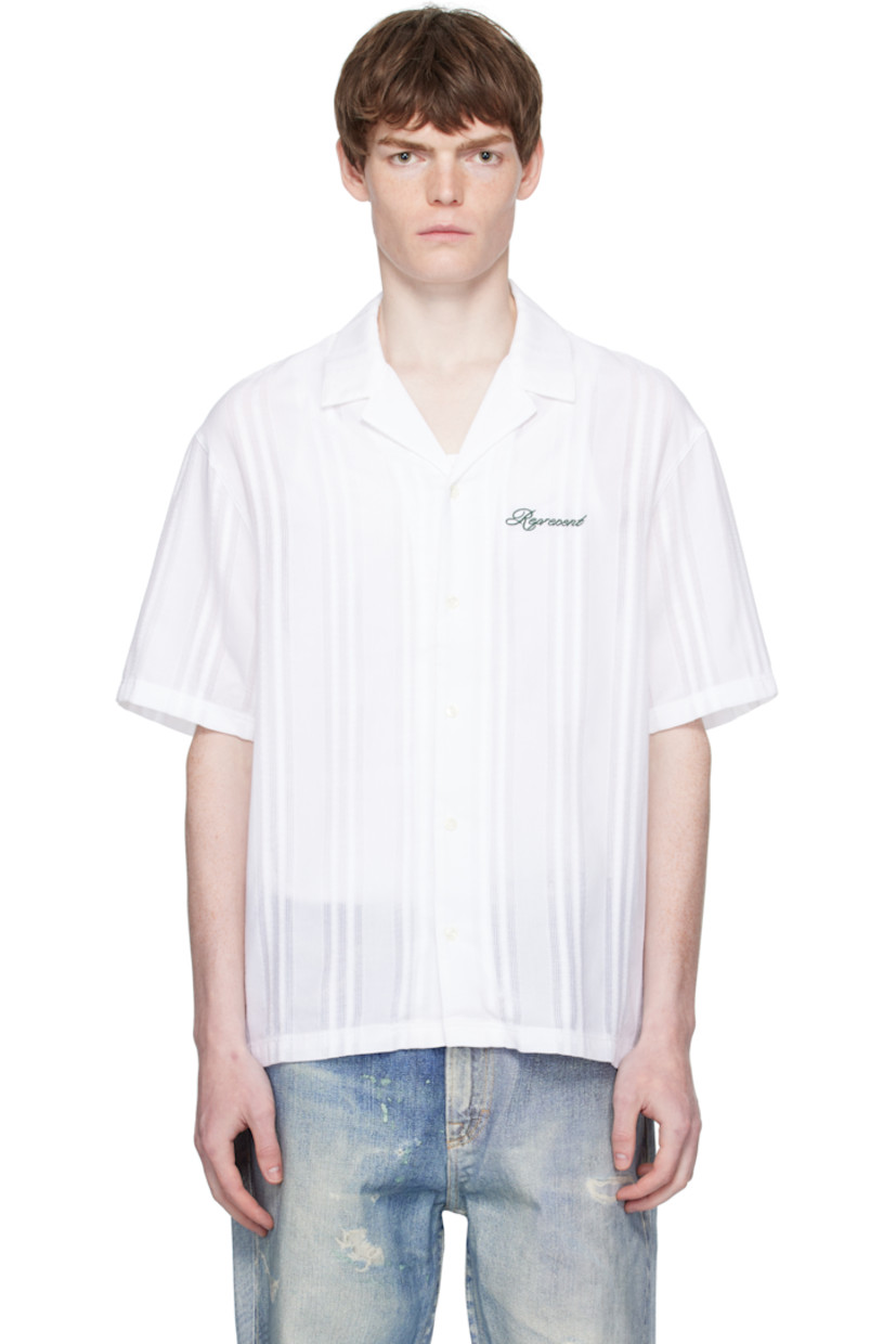 Semi-sheer plain-woven cotton shirt.

· Jacquard stripes throughout
· Open spread collar
· Button closure
· Logo embroidered at chest
· Vented side seams
· Logo flag at side seam

Supplier color: Antique white
