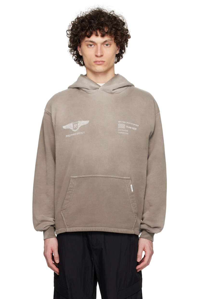 Oversized 480 gsm French terry hoodie. Fading throughout.

· Logo graphic and text printed at chest
· Logo plaque at kangaroo pocket
· Vented side seams
· Dropped shoulders
· Rib-knit cuffs
· Text and logo printed at back

Supplier color: Dark taupe