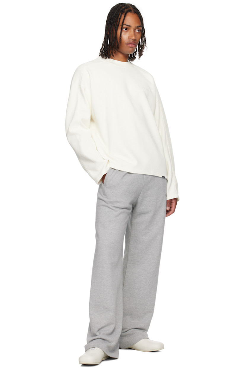 Waffle-knit cotton T-shirt.

· Rib-knit crewneck
· Logo embroidered at chest
· Logo plaque at front hem
· Yoke sleeves

Supplier color: White