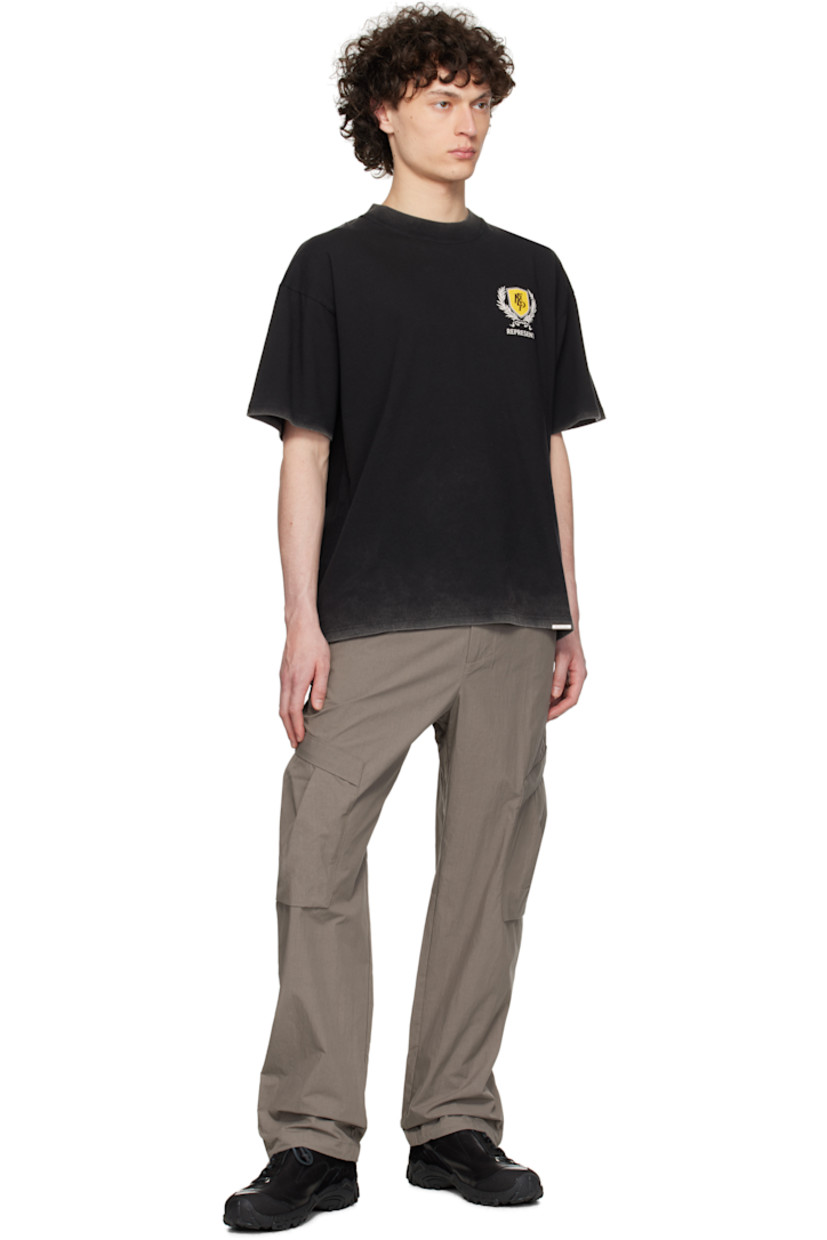 Oversized 220 gsm cotton jersey T-shirt. Fading throughout. 

· Rib-knit crewneck
· Logo graphic printed at chest
· Logo plaque at hem
· Dropped shoulders
· Logo, graphic, and text printed at back

Supplier color: Vintage black