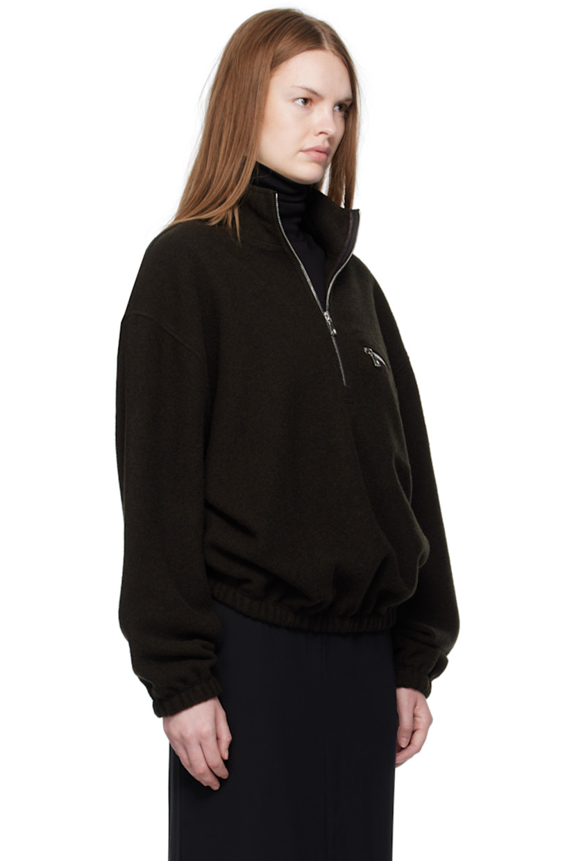 Lightweight virgin wool fleece sweater.

· Stand collar
· Half-zip closure
· Zip pocket at chest
· Elasticized hem and cuffs
· Locker loop at back yoke

Supplier color: Tourbe fleece