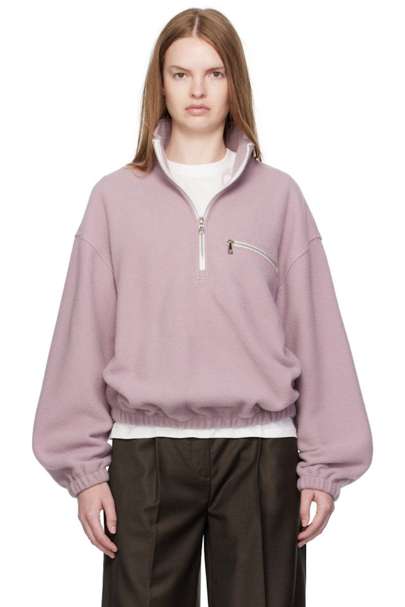 Lightweight virgin wool fleece sweater.

· Stand collar
· Half-zip closure
· Zip pocket at chest
· Elasticized hem and cuffs 
· Locker loop at back yoke

Supplier color: Myrte fleece