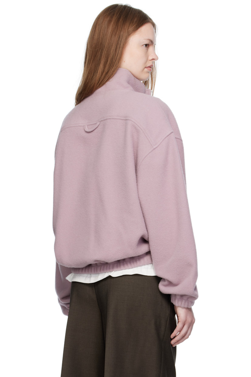 Lightweight virgin wool fleece sweater.

· Stand collar
· Half-zip closure
· Zip pocket at chest
· Elasticized hem and cuffs 
· Locker loop at back yoke

Supplier color: Myrte fleece