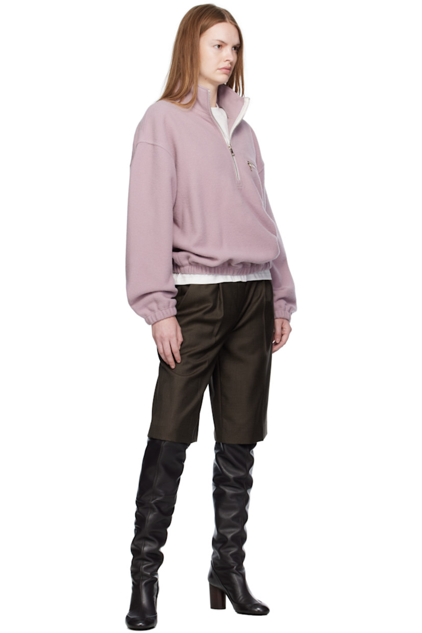 Lightweight virgin wool fleece sweater.

· Stand collar
· Half-zip closure
· Zip pocket at chest
· Elasticized hem and cuffs 
· Locker loop at back yoke

Supplier color: Myrte fleece