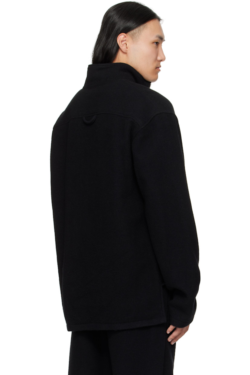 Brushed virgin wool fleece sweater.

· Stand collar
· Half-zip closure
· Tennis-tail hem
· Dropped shoulders
· Locker loop at back yoke

Supplier color: Black