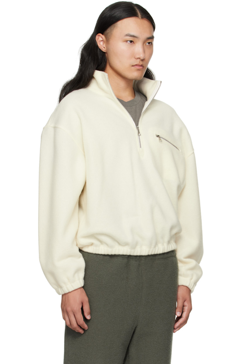 Lightweight brushed virgin wool fleece sweater.

· Stand collar
· Half-zip closure
· Zip pocket at chest
· Elasticized hem and cuffs
· Dropped shoulders
· Locker loop at back yoke

Supplier color: White
