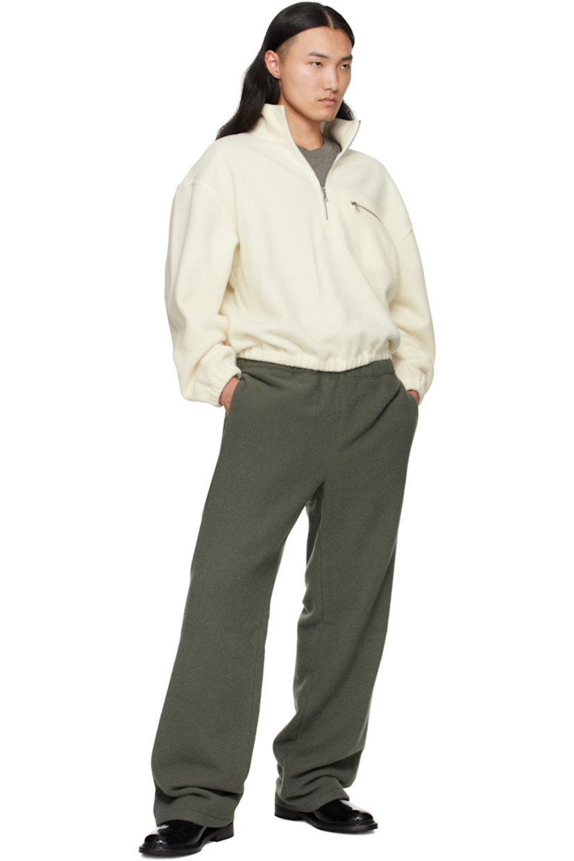 Lightweight brushed virgin wool fleece sweater.

· Stand collar
· Half-zip closure
· Zip pocket at chest
· Elasticized hem and cuffs
· Dropped shoulders
· Locker loop at back yoke

Supplier color: White