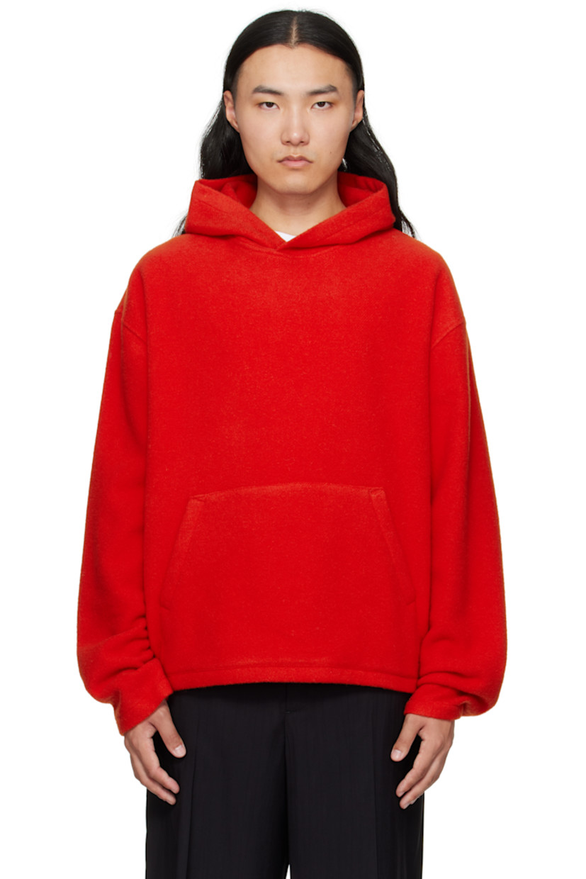 Lightweight brushed virgin wool fleece hoodie.

· Kangaroo pocket
· Dropped shoulders
· Locker loop at back yoke

Supplier color: Orange
