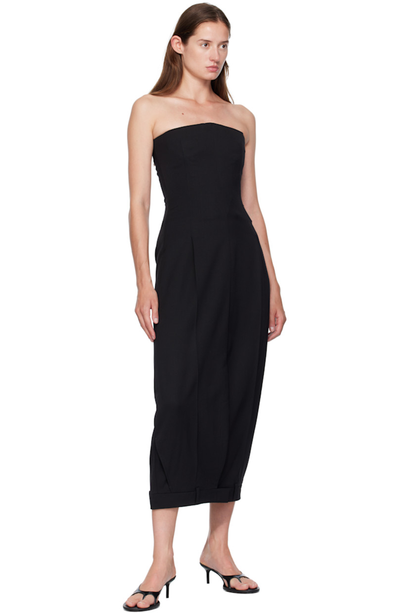Stretch virgin wool delaine maxi dress.

· Boning throughout
· Straight neck
· Zip vent at front hem
· Belt loops at hem
· Zip closure at side seam
· Welt pockets at back
· Full satin lining

Supplier color: Black