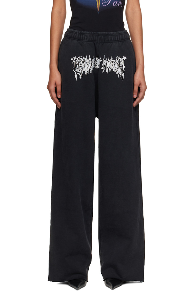 French terry lounge pants.

· Fading throughout 
· Concealed drawstring at elasticized waistband
· Three-pocket styling
· Logo printed at front
· Raw edge at cuffs 
· Logo embroidered at back pocket

Supplier color: Washed black