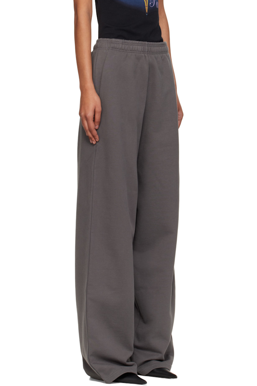 Cotton-blend French terry lounge pants.

· Fading throughout 
· Concealed drawstring at elasticized waistband
· Three-pocket styling
· Logo embroidered at front and back pocket 
· Raw edge at cuffs 

Supplier color: Magnet