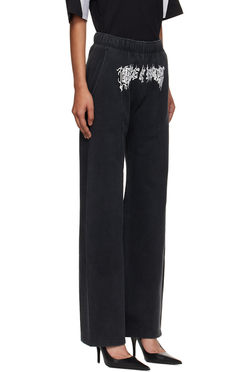 Flared French terry sweatpants.

· Fading throughout
· Concealed drawstring at elasticized waistband
· Two-pocket styling
· Darts at front and back
· Text printed at front

Supplier color: Washed black