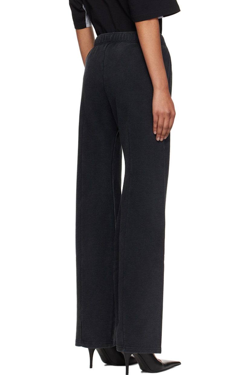 Flared French terry sweatpants.

· Fading throughout
· Concealed drawstring at elasticized waistband
· Two-pocket styling
· Darts at front and back
· Text printed at front

Supplier color: Washed black