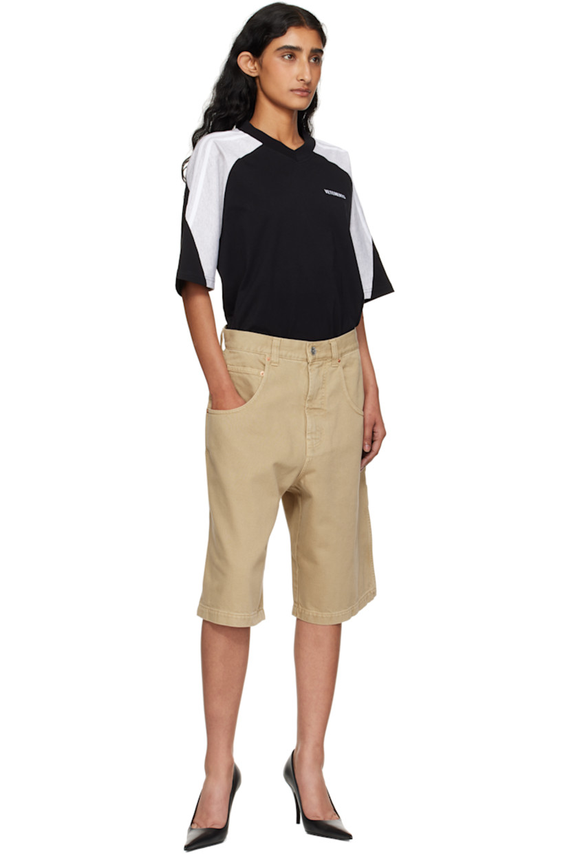 Non-stretch denim shorts.

· Belt loops
· Five-pocket styling
· Zip fly
· Hammer loop at outseam
· Patch pockets and embroidered logo at back leg
· Logo-engraved silver- and copper-tone hardware

Supplier color: Camel