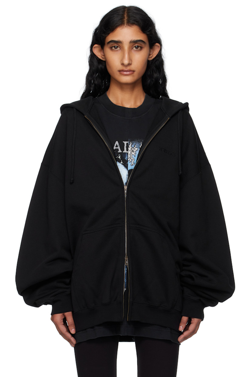 French terry hoodie.

· Drawstring at hood
· Logo embroidered at hood and back collar
· Two-way zip closure
· Patch pockets at front
· Rib-knit hem and cuffs
· Dropped shoulders

Supplier color: Black