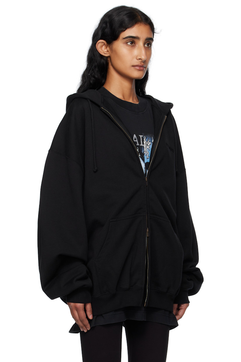 French terry hoodie.

· Drawstring at hood
· Logo embroidered at hood and back collar
· Two-way zip closure
· Patch pockets at front
· Rib-knit hem and cuffs
· Dropped shoulders

Supplier color: Black