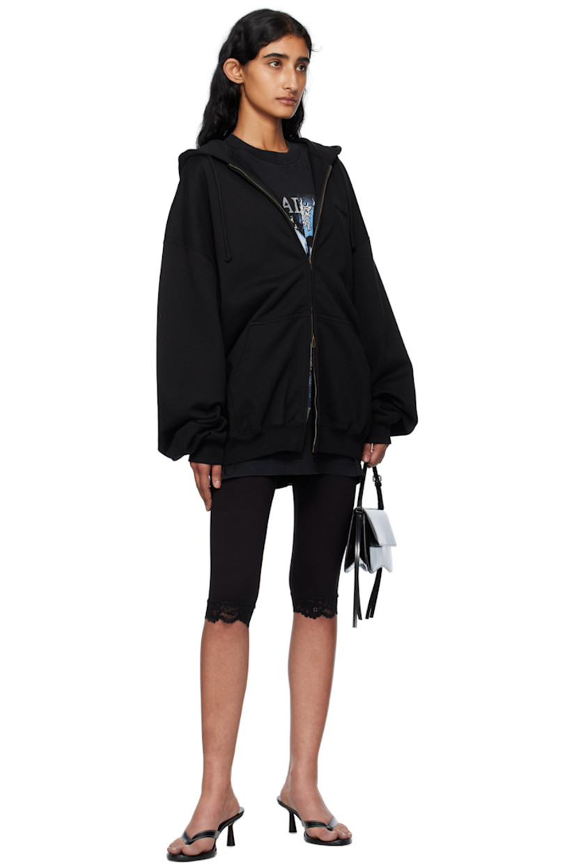 French terry hoodie.

· Drawstring at hood
· Logo embroidered at hood and back collar
· Two-way zip closure
· Patch pockets at front
· Rib-knit hem and cuffs
· Dropped shoulders

Supplier color: Black